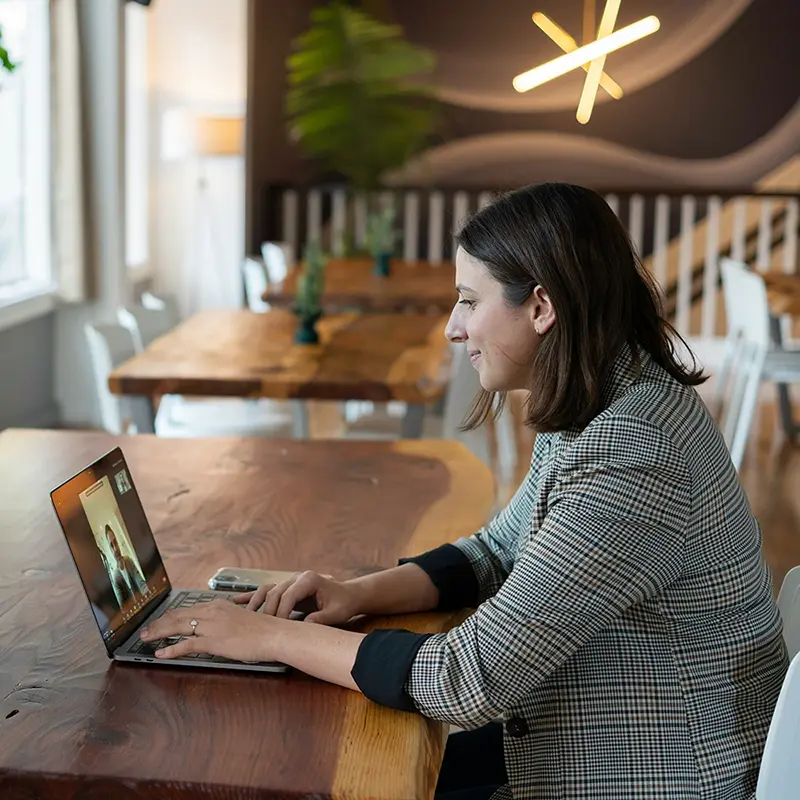 A real estate agent talking to a client via video conference